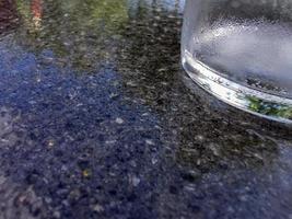 iced glass on black marble detail photo