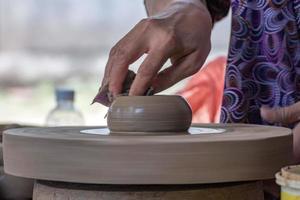 hands while working pottery close up detail photo