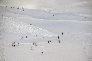 skiers on alps snow background photo