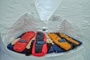 Sleeping bag inside igloo snow ice photo