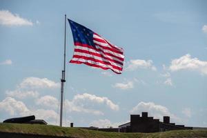 fort mchenry baltimore usa flag while waving photo