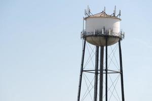 Water tower in the deep blue sky background photo