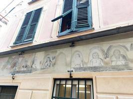 the grotesques in Levanto liguria village Italy old 1500 paintings photo