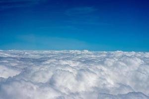 clouds in the sky from airplane window photo