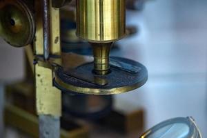 Old ancient microscope detail close up photo