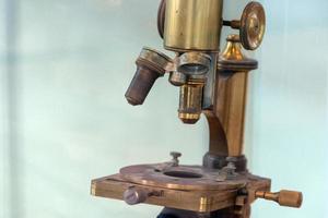 Old ancient microscope detail close up photo