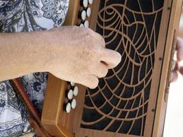 Hands playing french accordion detail photo