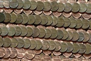 hundreds of one penny coins detail photo