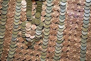 hundreds of one penny coins detail photo