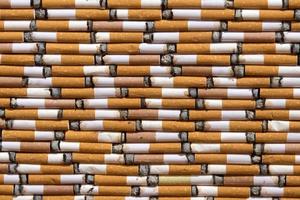 many cigarette butts close up photo