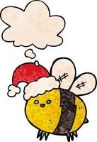 linda abeja de dibujos animados con sombrero de navidad y burbuja de pensamiento en estilo de patrón de textura grunge vector