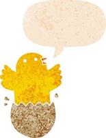 cartoon hatching bird and speech bubble in retro textured style vector