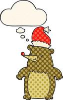 cartoon bear wearing christmas hat and thought bubble in comic book style vector