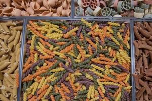 colorful italian made pasta on display photo