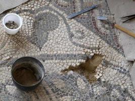 restoring of Ancient Roman mosaic of Villa del Casale, Sicily photo