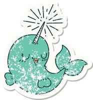 worn old sticker of a tattoo style happy narwhal vector
