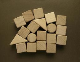 Wooden Geometric Shapes Cube on Paper photo