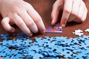 attaching of jigsaw puzzles photo