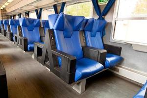 blue leather seats in train photo