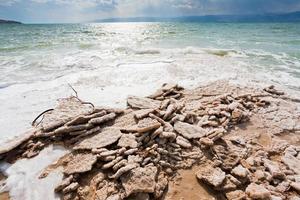 crystalline salt on beach of Dead Sea photo