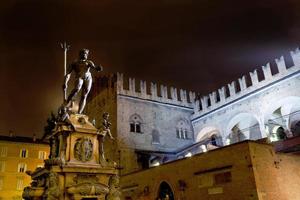 Fountain of Neptune in Bologna at night photo