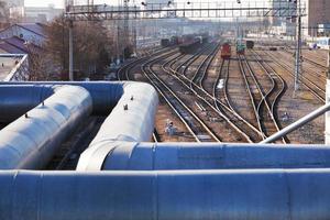 industrial landscape with pipes and railway lines photo