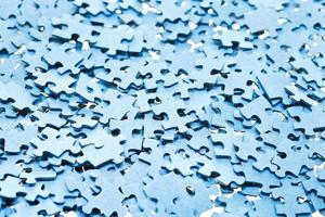 pile of disassembled blue puzzle pieces photo