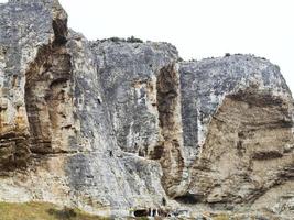 climbers climb on rock in Crimean Mountain photo