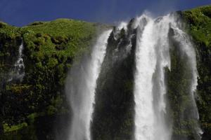 Seljalandsfoss waterfall on the southern coast of Iceland on a sunny day photo