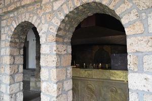 church candles are burning near a Christian church photo