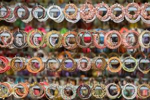 Bracelets in indonesia market on display stand photo