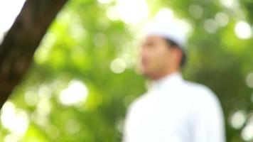 Young asian muslim man praying to Allah of god.Ramadan festival concept. video