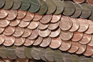 hundreds of one penny coins detail photo