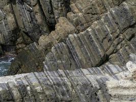 cliffs by the sea in monterosso riomaggiore cinque terre pictoresque village photo