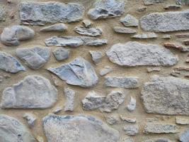 Detalle de la pared de piedra del edificio medieval foto