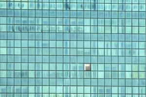 sakyscraper shining windows pattern with one open photo