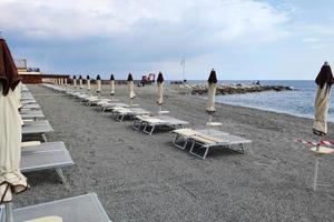 Bathhouse beach club preparation set up for summer season in Italy photo