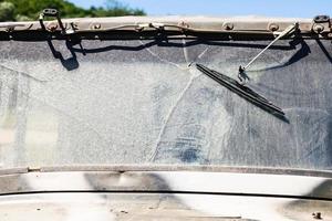 dirty and broken windshield of off-road vehicle photo