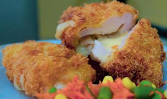 This is home cooking, Chicken Cordon bleu or schnitzel cordon bleu is a dish of chicken meat wrapped in cheese, then breaded and fried. photo