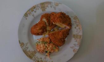 This is home cooking, Chicken Cordon bleu or schnitzel cordon bleu is a dish of chicken meat wrapped in cheese, then breaded and fried. photo