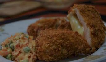 This is home cooking, Chicken Cordon bleu or schnitzel cordon bleu is a dish of chicken meat wrapped in cheese, then breaded and fried. photo