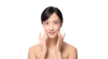 Portrait of beautiful young asian woman clean fresh bare skin concept. Asian girl beauty face skincare and health wellness, Facial treatment, Perfect skin, Natural make up on white background photo