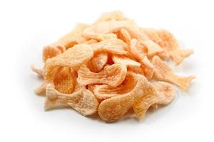Fried prawn crackers or shrimp crackers in the shape of red fish photo