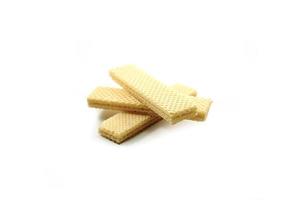 Delicious wafer sticks arranged in a pyramid shape isolated on a white photo