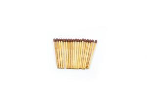 a collection of matchsticks neatly arranged isolated on a white photo