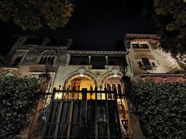 ROME, ITALY - JUNE 14 2019 - Coppede unusual style architechture district in roma buildings at night art nouveau liberty photo