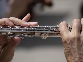 hands playing traverse flute photo