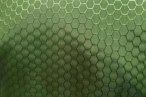 metallic green hexagonal synthetic fabric pattern background photo