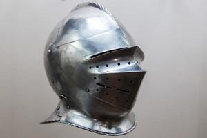 medieval war helmet iron isolated on white photo