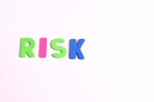 Word risk lettering, on white background photo